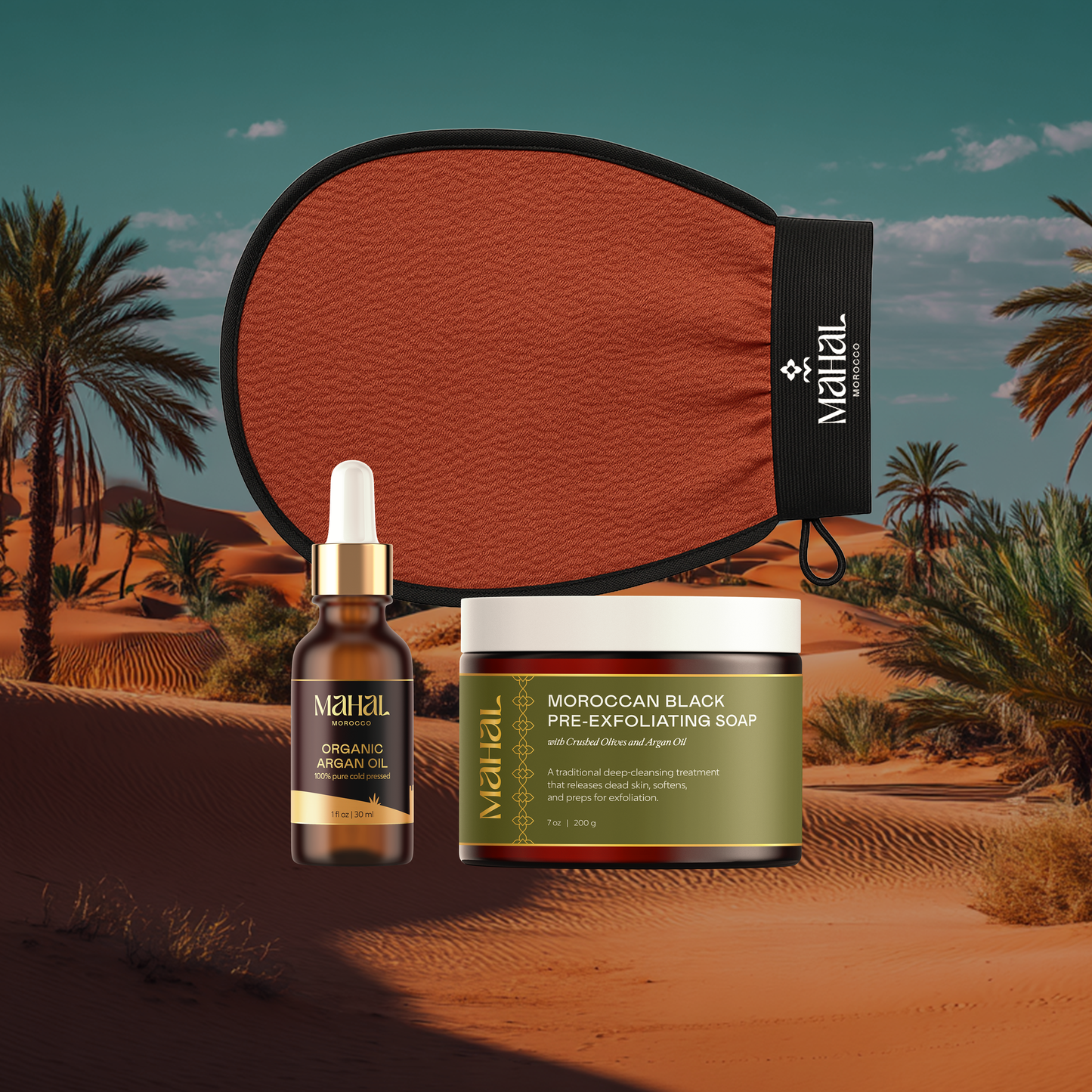 Complete ritual set featuring soap, glove, and argan oil over a desert background.